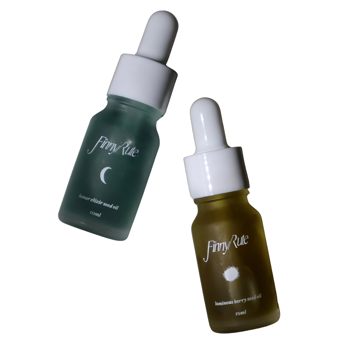Two skincare serum bottles with droppers on a white background