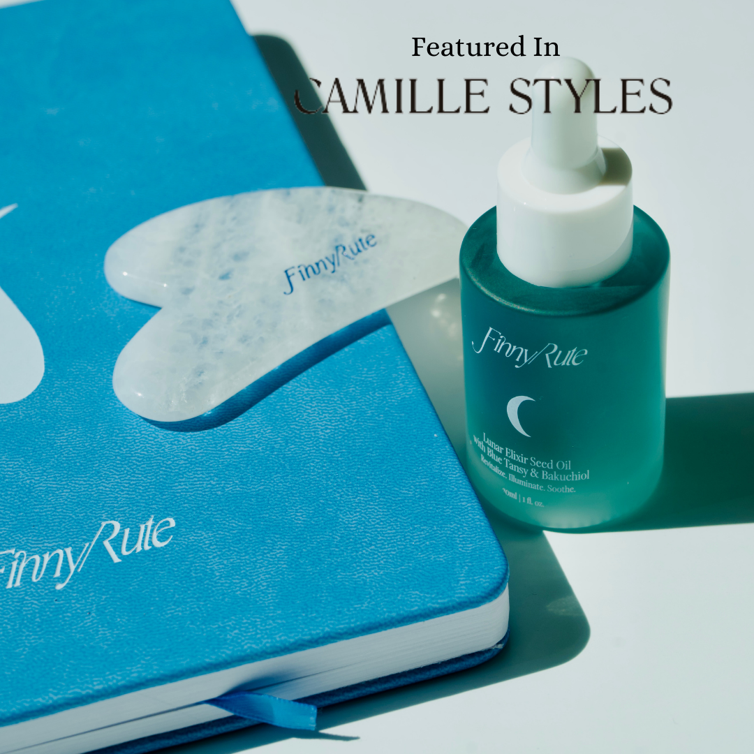 A product image featuring a blue affirmation journal, a small bottle of 'Lunar Elixir Seed Oil' and a 'Gua Sha' tool, with the brand name 'FINNY RUTE' prominently displayed.