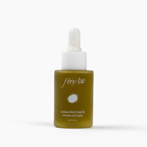 Skincare serum bottle with white cap and olive green body on a white background