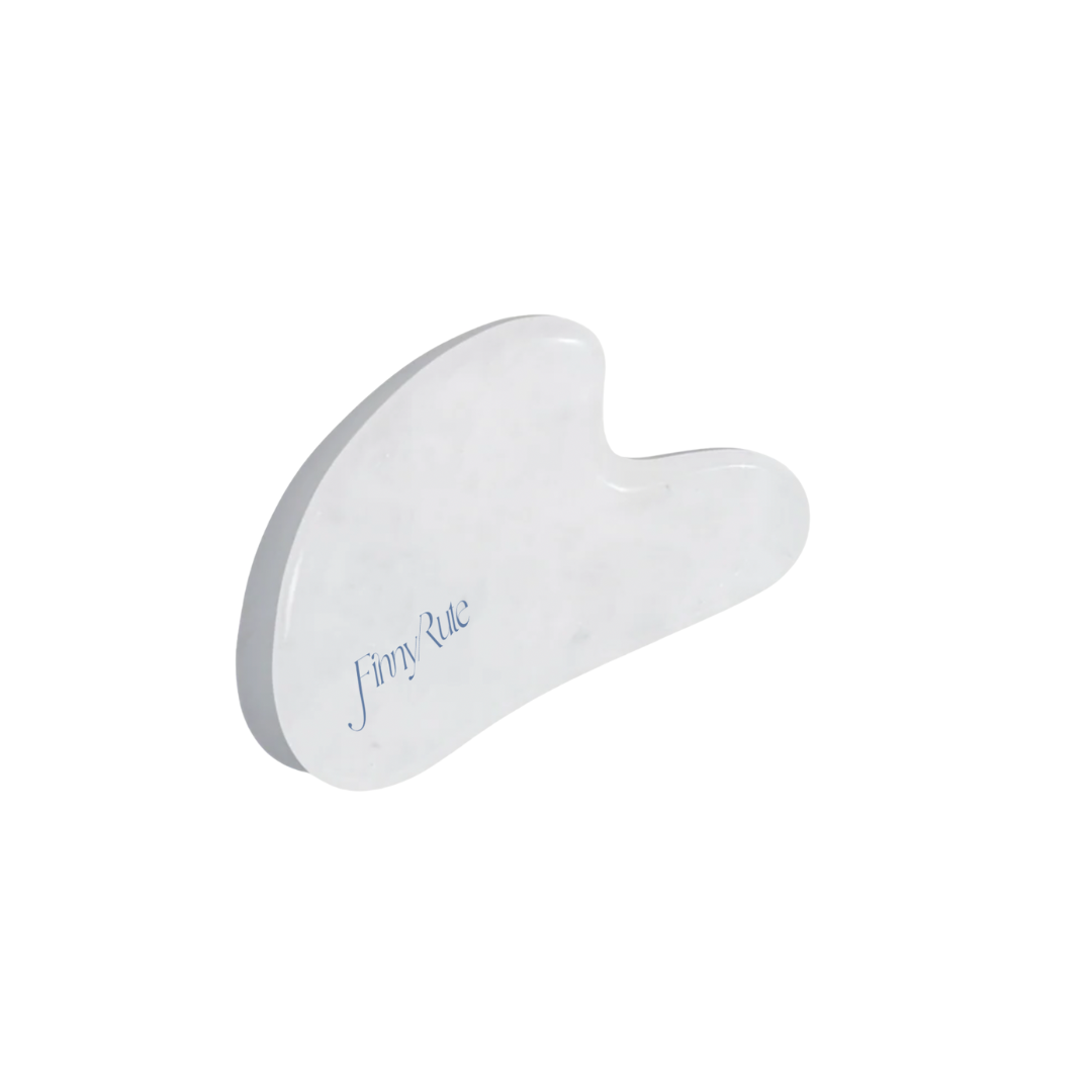 White Gua Sha tool on a white background